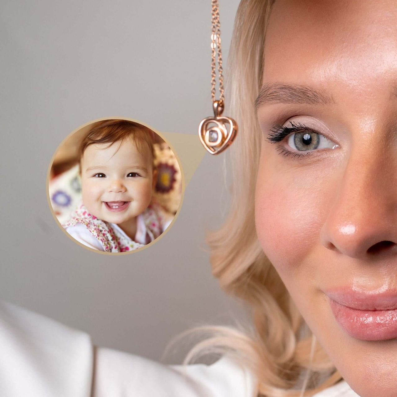 Woman wearing Timeless Photo Necklace with heart-shaped pendant featuring a smiling baby photo, by Brother & Sisters.