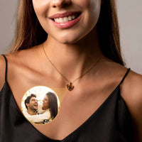 Thumbnail for Model wearing Timeless Photo Necklace with a cherished photo of loved ones inside the heart pendant by Brother & Sisters.