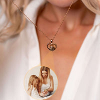 Thumbnail for Timeless Photo Necklace worn by a woman, showcasing its heart shape, highlighting cherished moments with loved ones.