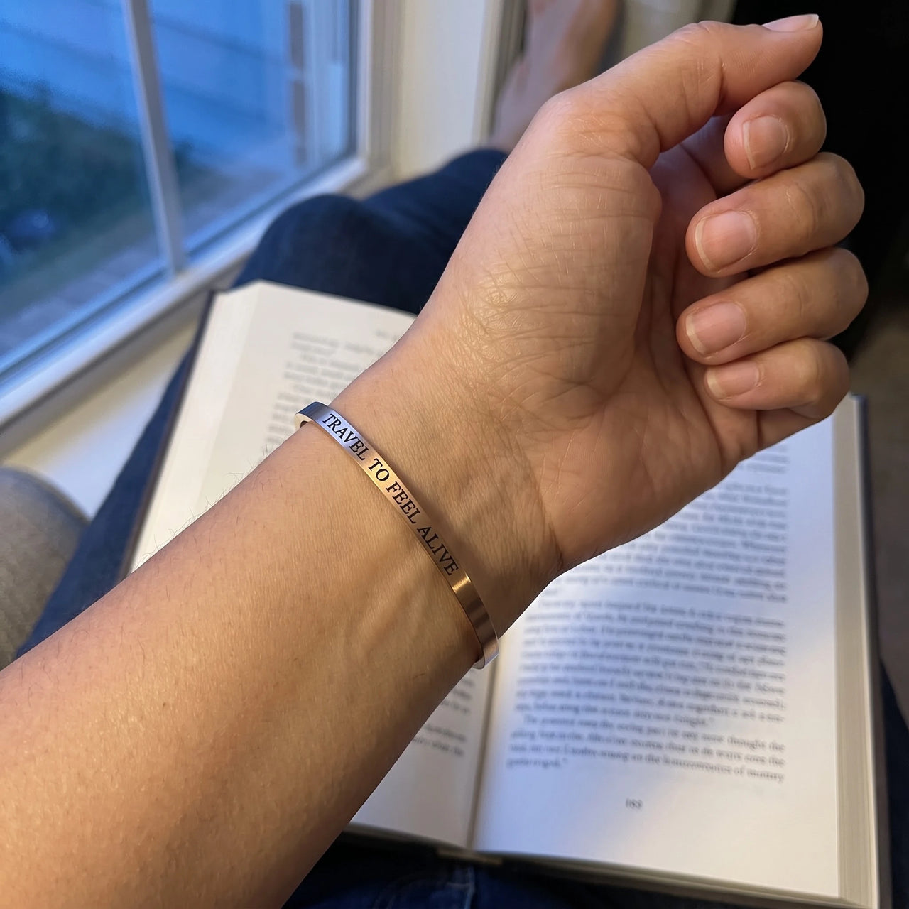 Travel To Feel Alive bracelet in rose gold worn, showing its real size | SKU: ttfa-rg