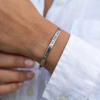 Thumbnail for Close-up of the Travel To Feel Alive bracelet in silver worn | SKU: ttfa-wg