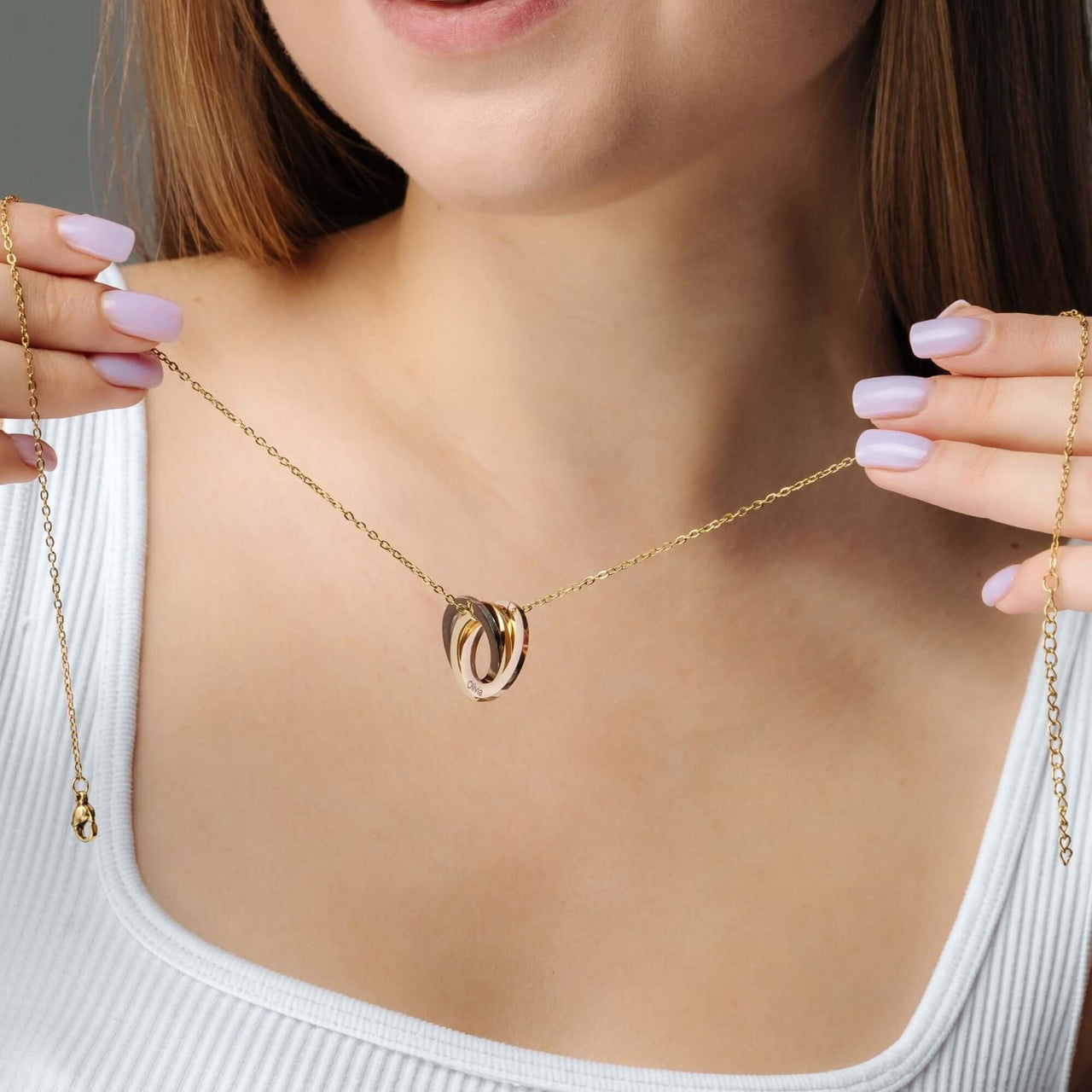 Triple Name Necklace showcased on a model, highlighting its elegant design and meaningful personalization by Brother & Sisters.