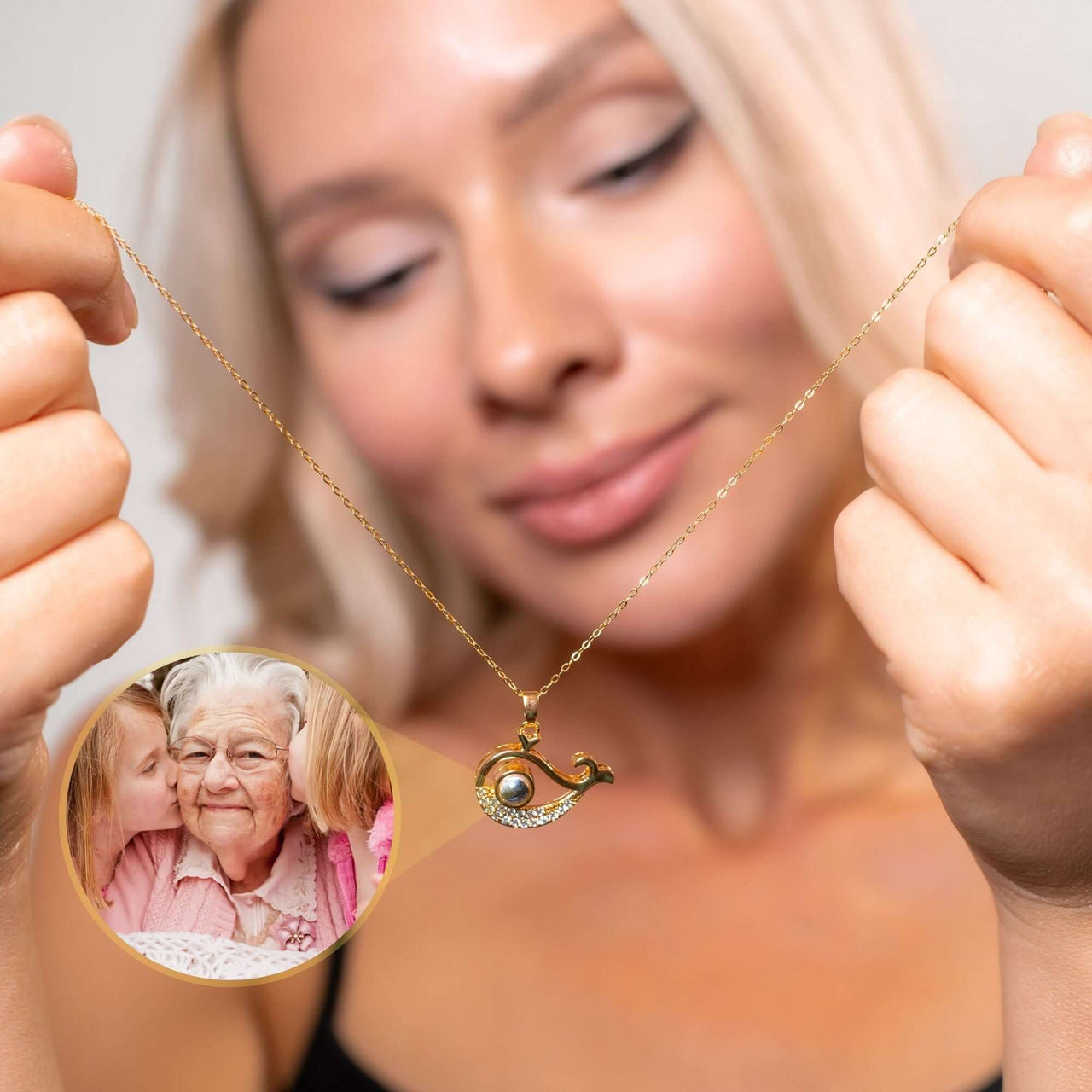 Woman wearing Whale Photo Necklace showing cherished family photo, designed by Brother & Sisters, showcasing ocean beauty.