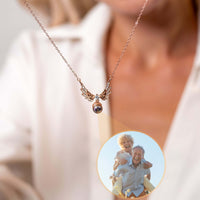 Thumbnail for Wings Photo Necklace by Brother & Sisters, featuring a personalized photo in elegant angel wings.