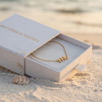 Thumbnail for Year Number Anklet in Brother & Sisters gift box on beach
